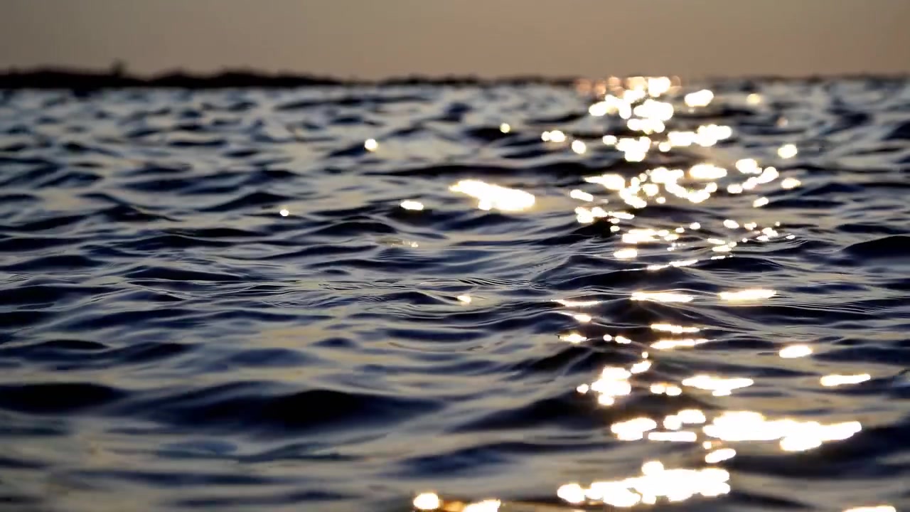 Golden Hour Sunlight Sparkling on Gentle Ocean Waves