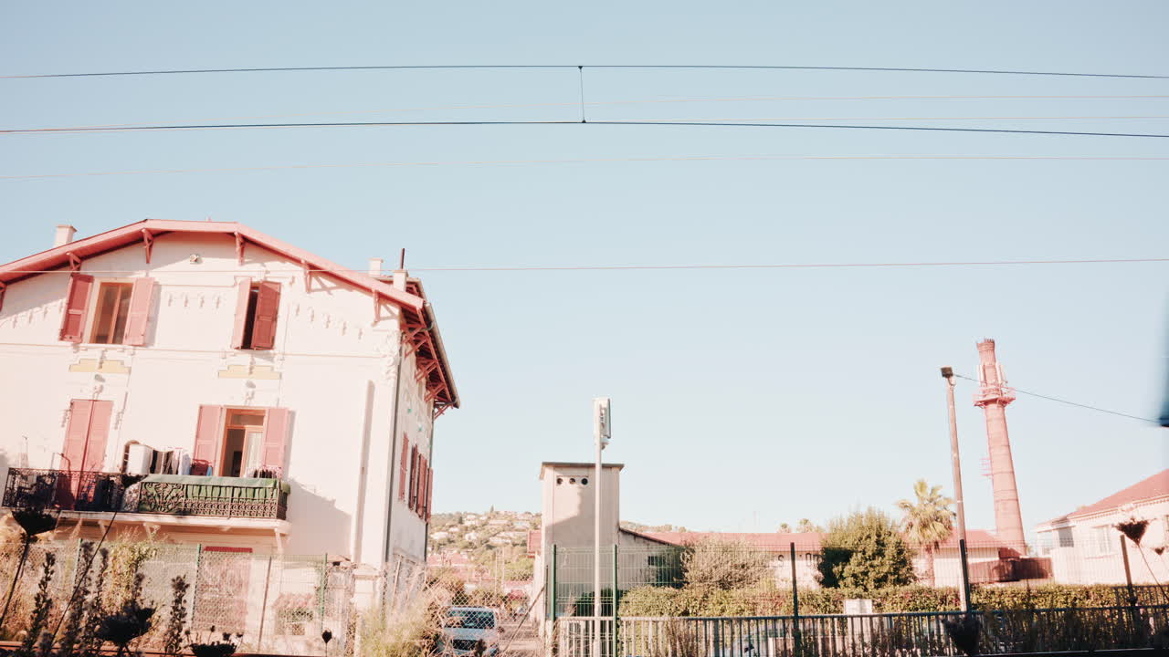 Dynamic shot of a fast train moving across the frame at high speed, creating cinematic motion blur