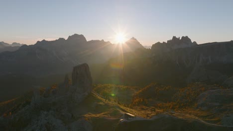 a sunset over the peaks of the dolomite mountains