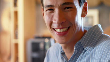 Smiling-man-at-counter-in-restaurant-4k