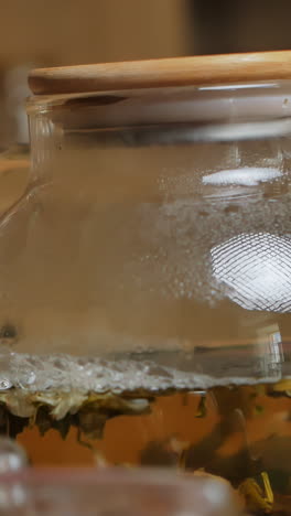 close-up of teapot with tea leaves