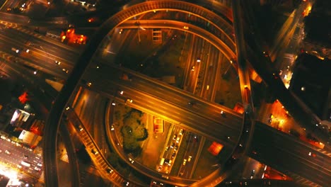 drone footage from a highway crossing in buenos aires, at night