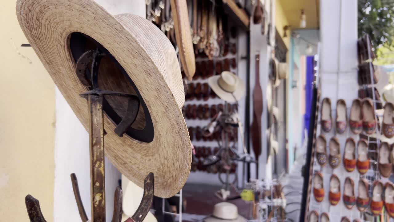 Close up shot of hats from a souvenir store in downtown Tlayacapan during the day in Morelos, Mexico