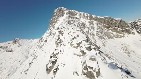 Fully-ascending-the-mountain-Skittentind-in-Norway,-revealing-a-great-view