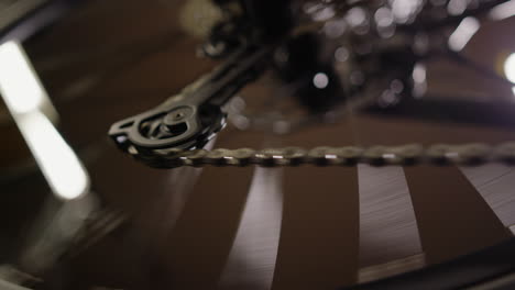 close-up of spinning bicycle gear and chain in motion – high-speed cycling mechanics detail - uhd