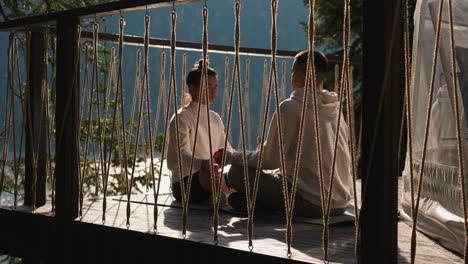 partners engage in head-to-head meditation. young husband and wife partake in yoga exercises designed for cultivation mental clarity. inner balance