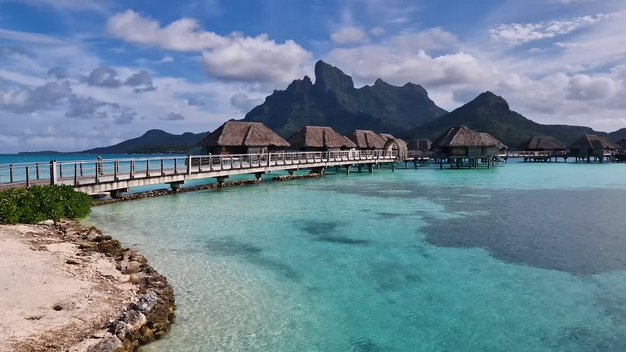 Luxury Tropical Resort on Bora Bora Island, French Polynesia. Overwater Bungalows, Turquoise Lagoon and Volcanic Hills