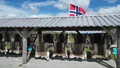 Reindeer-skin-and-blankets-in-souvenir-shop-in-Norway,-Scandinavia---Pan-Right