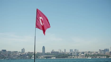 turkish flag waving over istanbul skyline