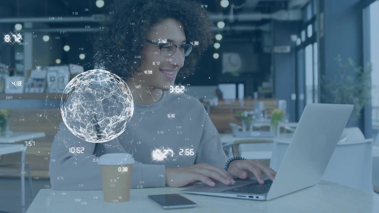 Animation of data processing and globe over smiling businessman using laptop