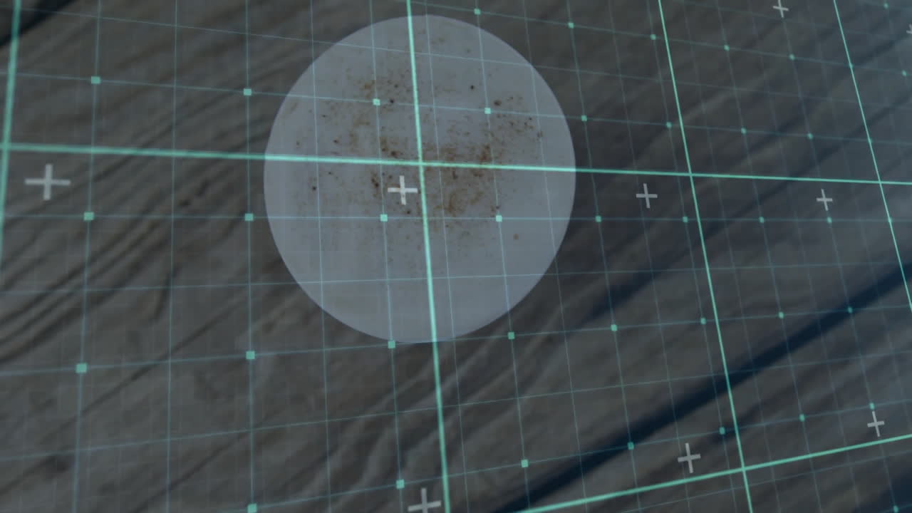 Digital scanning HUD appearing on wood surface, showing turquoise grid and speckled overlay