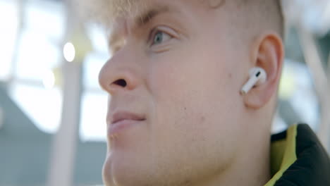 young man wearing earbuds