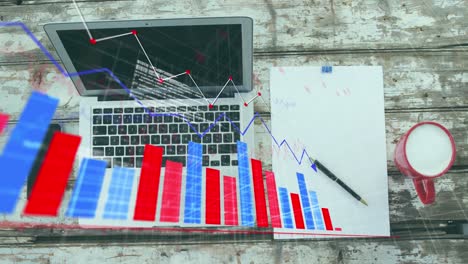 Animation-of-multiple-graphs,-coffee-cup-and-computer-language,-overhead-view-of-laptop-and-notepad