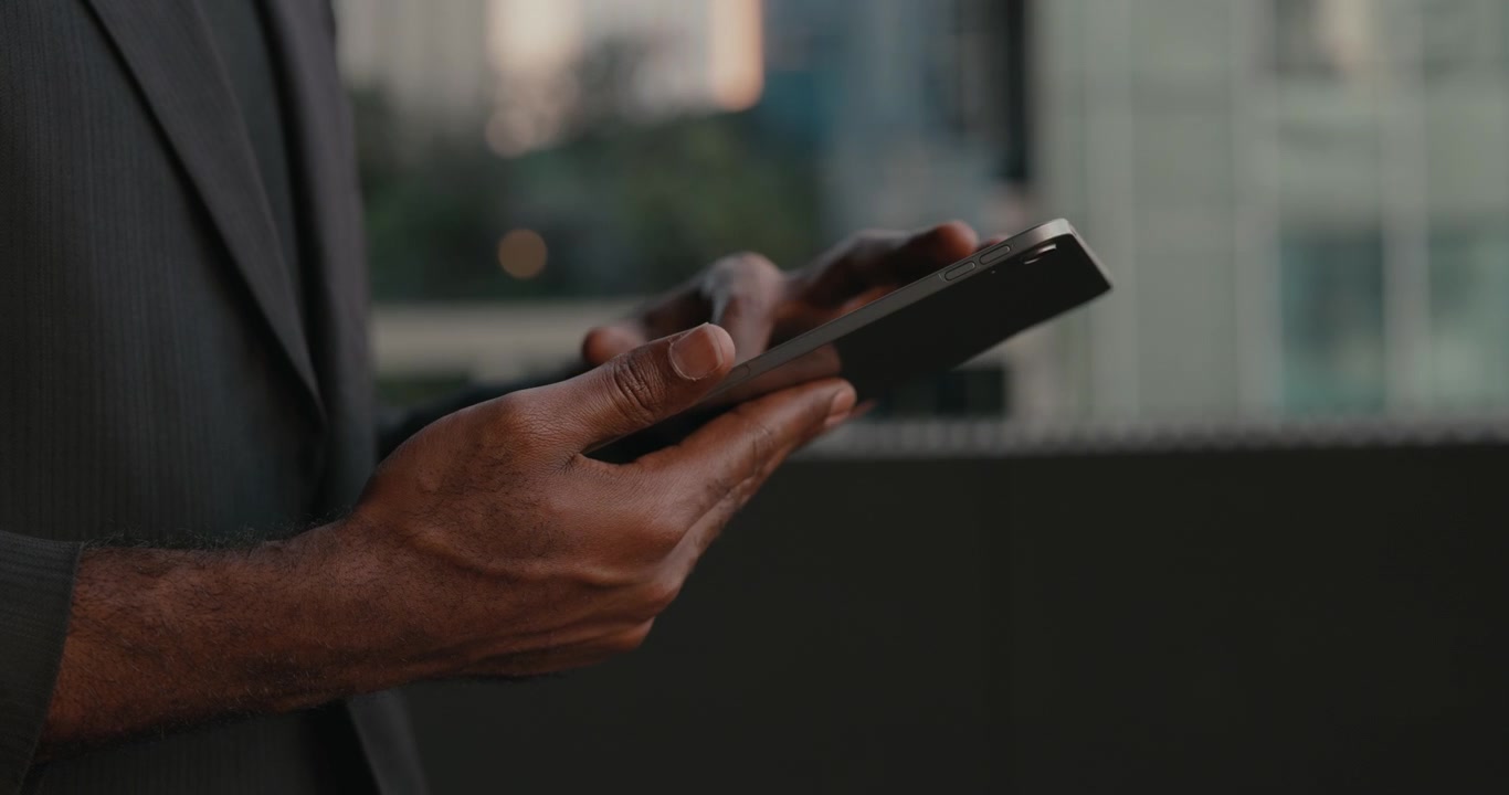 Businessman Using Tablet Computer Outdoors in City