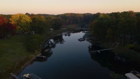 Descending-and-Landing-Motion-closing-in-on-a-small-creek-at-the-mouth-of-a-Lake-in-Autumn