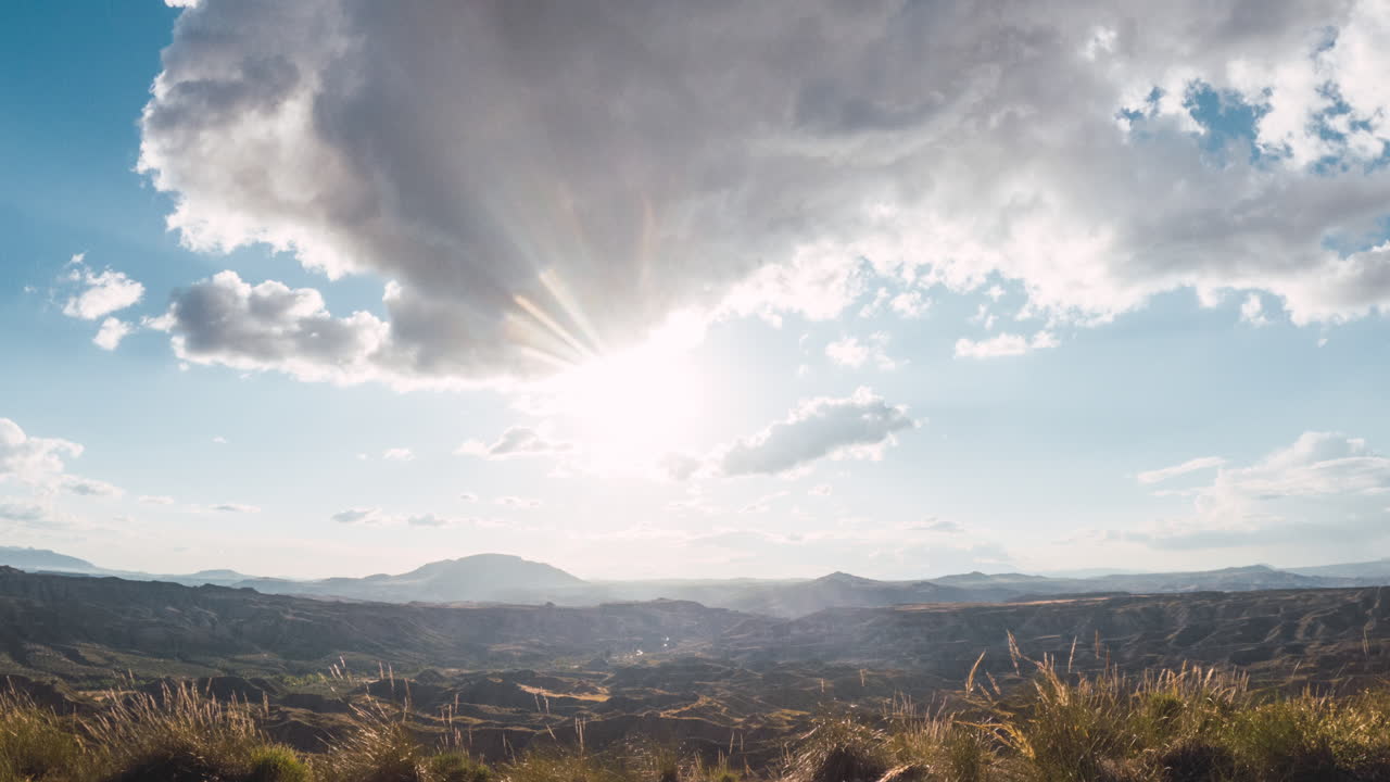 Scenic Mountain Landscape with Clouds and Sunlight