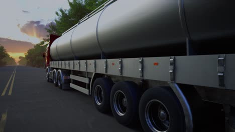 Gasoline Tanker Truck On Asphalt Road. Fuel Semi Truck Fast Driving On Straight Freeway In Countryside Dense Forest At Summer Sunset