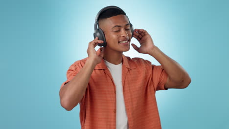 Headphones,-dancing-and-young-man-in-a-studio