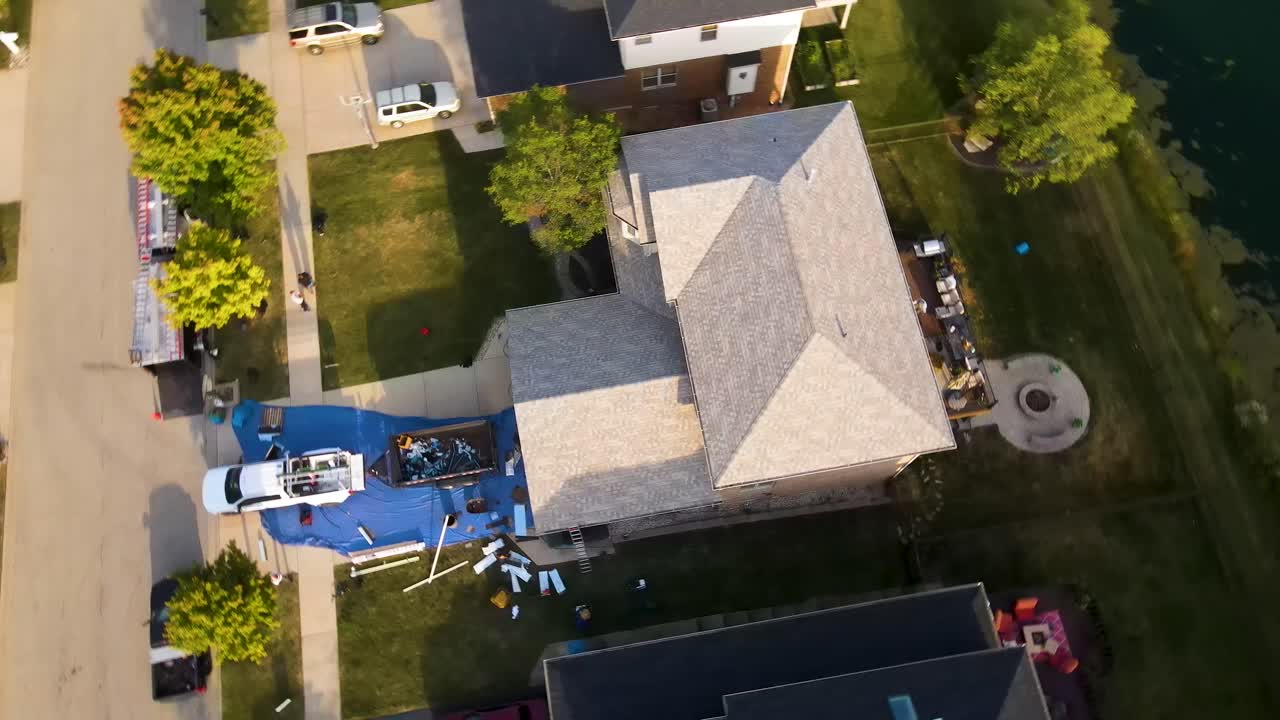 Roof Repair and Replacement: Aerial View of Suburban Home
