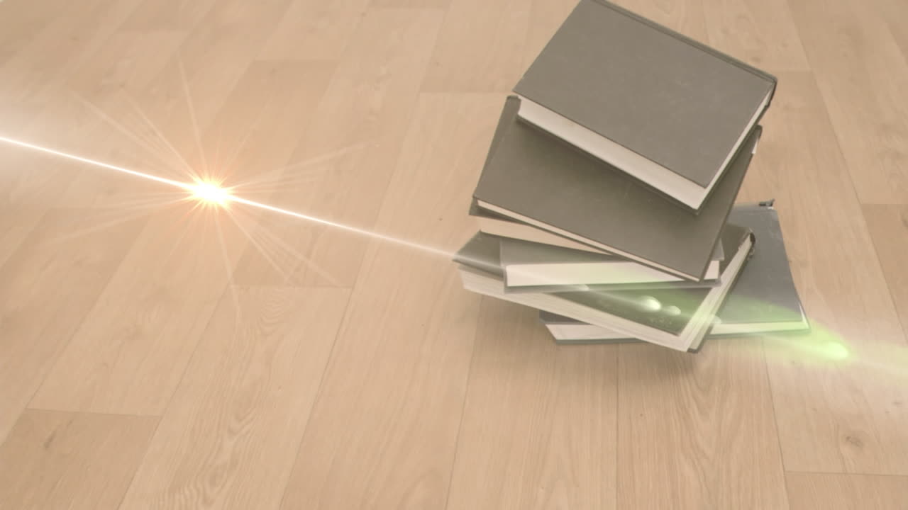 Animation of glowing spot over stack of books on wooden background