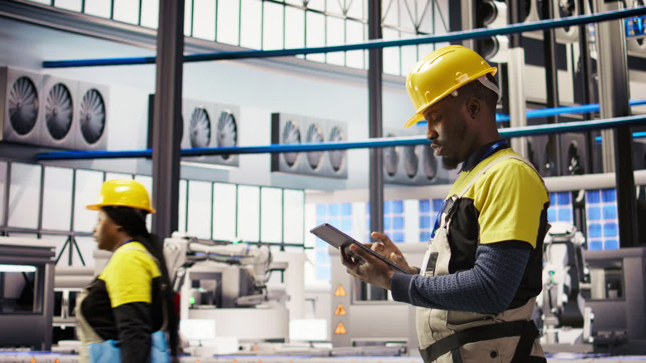 Vertical video Smart factory mechanic testing automated systems, doing preventive maintenance