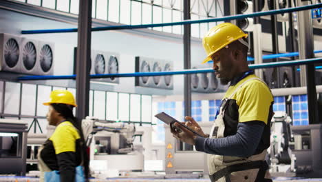 vertical video smart factory mechanic testing automated systems, doing preventive maintenance