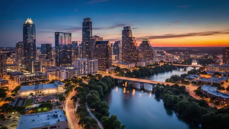 city skyline at dusk with illuminated buildings and river