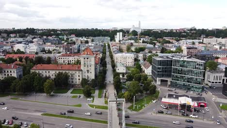 straight simonas daukantas street and pedestrian bridge in kaunas city, aerial drone view