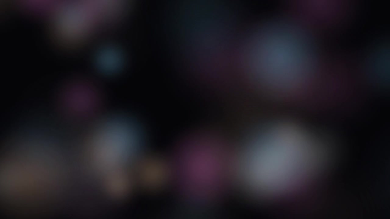 Abstrakt baggrund med blødt glødende farverige bokeh-lys