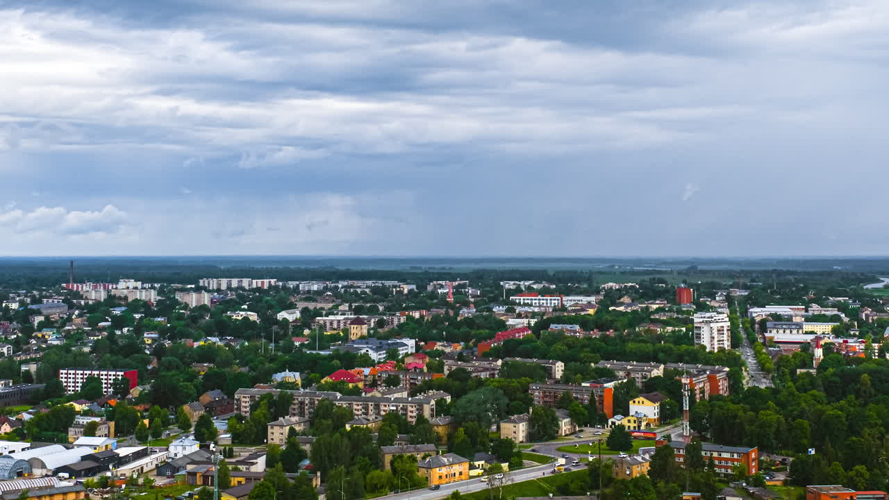 Urban hyperlapse view under cloudy sky with expansive cityscape