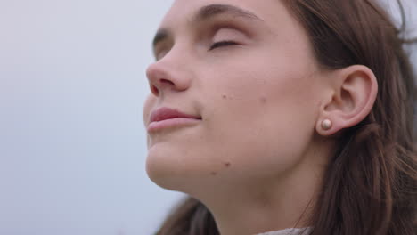 close up portrait of happy woman looking up smiling enjoying freedom outdoors exploring wanderlust contemplating spiritual journey in countryside breathing fresh air feeling positive