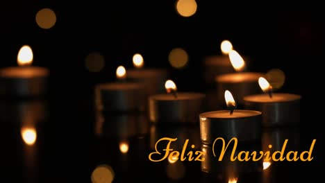 animation of feliz navidad text over candles