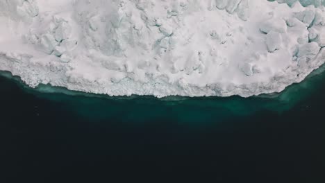 drone over sea and ice of ilulissat icefjord