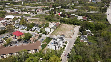 aerial tilt up footage of rural city in canada during sunlight