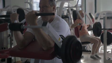 man working out on biceps in the gym