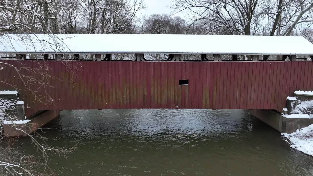 Aerial view of the side of a wooden covered bridge