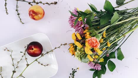 peach and flower arrangement