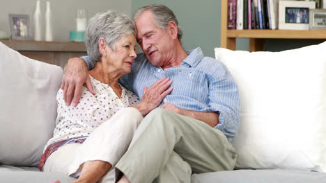 Senior-couple-embracing-in-living-room