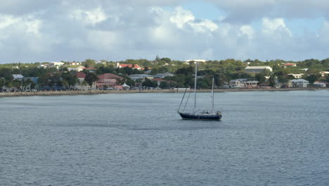 single sailboat docked in bay