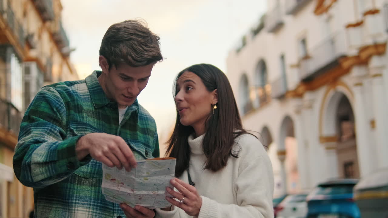 Couple Exploring Seville With Map