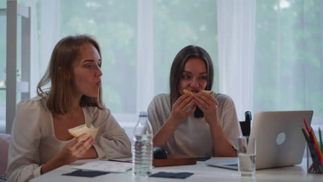 hungry students eat fresh sandwiches watching online lecture