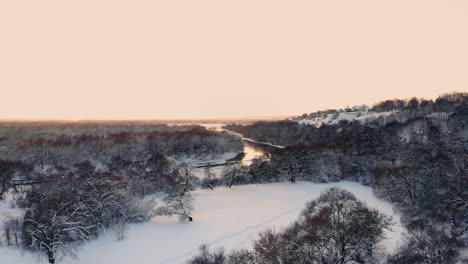 snow-falling.-winter-wonderland.-snowing-snowy.-sunset-dusk-sunshine.-forest-trees-woods-nature.-slow-motion.-winter-background.-romantic-wonderland.-beautiful-environment