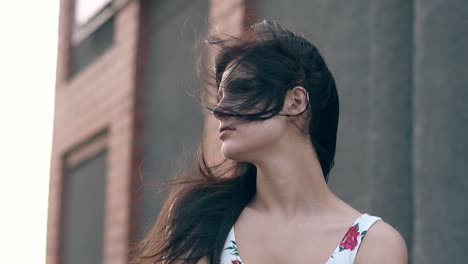 close view young woman with loose flowing brunette hair