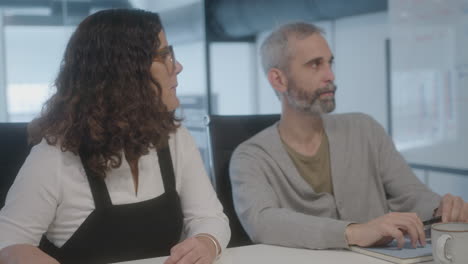 mature coworkers having business meeting in the office