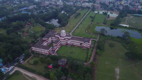 historical monument cooch behar royal palace surrounded by beautiful parks on the bank of river torsa in cooch behar city, west bengal, drone view