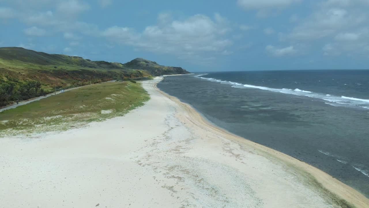 An aerial view of a white sand beach in Sabtang, Batanes