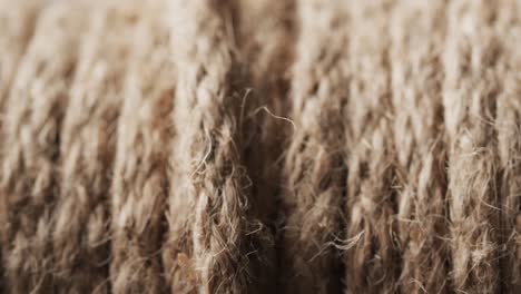 Micro-video-of-close-up-of-brown-string-with-copy-space