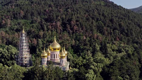 shipka memorial church amid dense forest at the foot of stara planina mountain range bulgaria