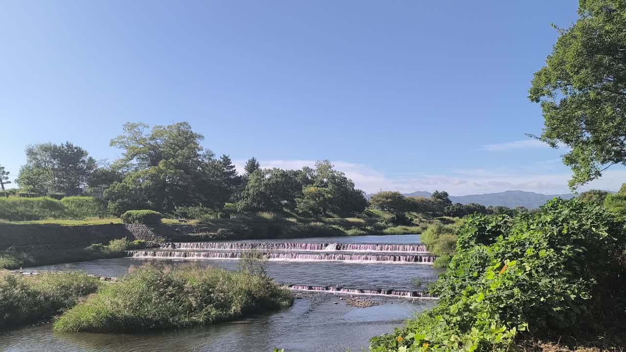 Natural Kamo River cascades Landscape in Kyoto Japan City Nature with Sunshine