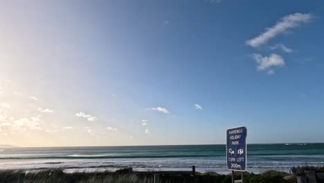 calm ocean waves under a clear blue sky